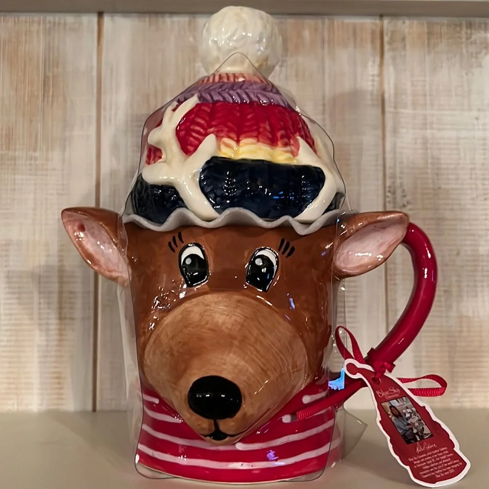 NWT blue sky, handcrafted, reindeer mug. It‎ has the lid on it,